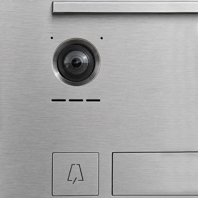 Detail of a Hikvision video intercom system with a stainless steel multi-tenant enclosure for 3 households, model Tadao MA18210, designed for flush-mounted installation with front-access opening.